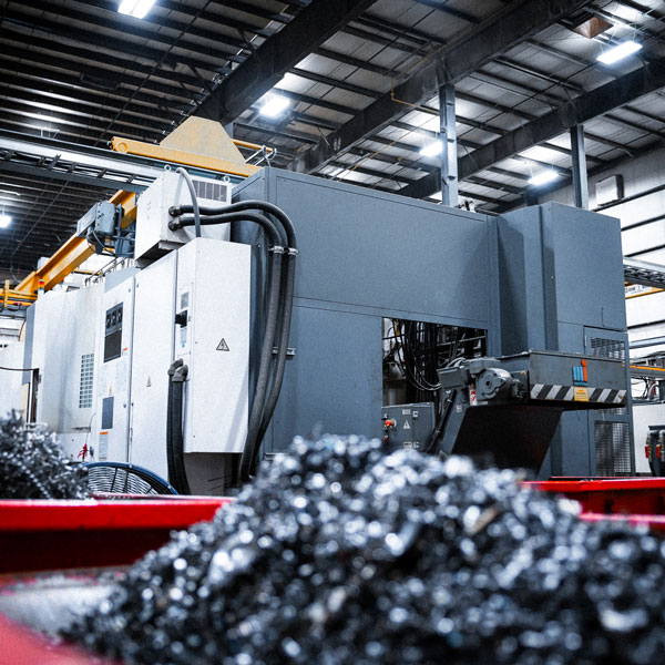machine with metal scrap in foreground